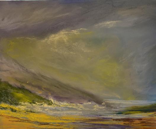 Beach with a low hill behind and the sea to the right