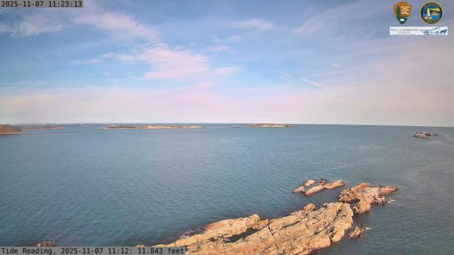 Camera looking north from Boston Light on Little Brewster Island. View looks toward the northern approaches into Boston Harbor, with Graves Light visible into the distance. The smaller Brewster Islands, Middle and Outer, are in the midground, with the Shag Rocks on the near right.
