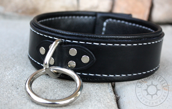 A black leather collar with silver stitching, nickel hardware, and a chunky loop-and-ring attachment