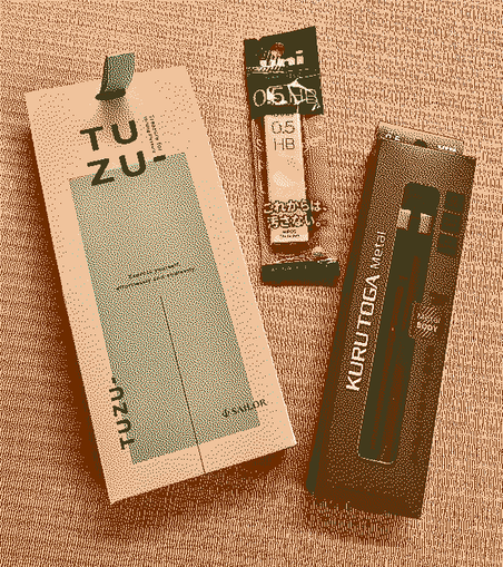 Pen and pencil in box.