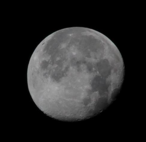A close up of the nearly full moon. Shadows on the craters in the southern hemisphere are clearly visible. Photo by Robert Emond.