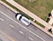 Image of a white work truck parked in front of a house of person who is missing