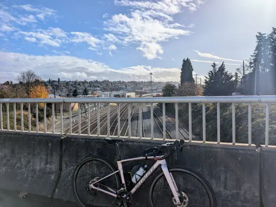 My road bike on the bridge overseeing train tracks in Magnolia, Seattle, WA.