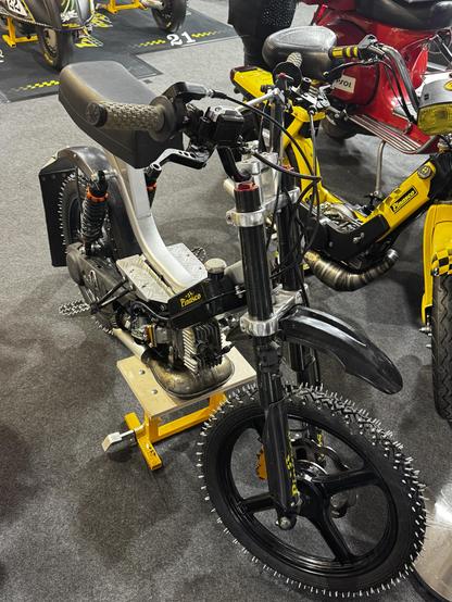 Small motorcycle with pins in the tyres