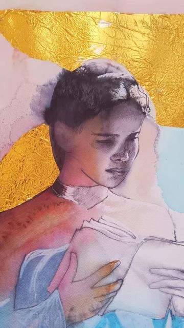 The head and torso of a young woman who is intently reading; she is wearing a light pink sweater over a white top. Her dark hair is pulled back and she has a baby blue blanket tucked up around her.