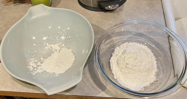 two bowls of flour, one white, one clear glass, both with flour in as described in the toot.