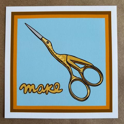 an original art print by AnneArchy depicting a pair of gold bird scissors with hand lettering of the word "make"
