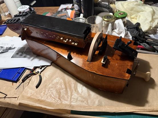 Photo of the hurdy gurdy with the key box lid and wheel attached.