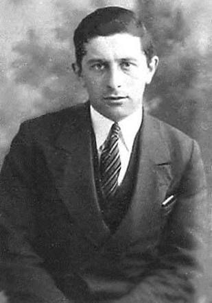 A portrait photo of a young men dressed in a suit.