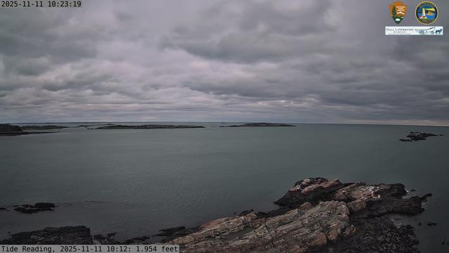 Camera looking north from Boston Light on Little Brewster Island. View looks toward the northern approaches into Boston Harbor, with Graves Light visible into the distance. The smaller Brewster Islands, Middle and Outer, are in the midground, with the Shag Rocks on the near right.