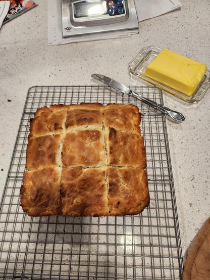 Buttermilk biscuits cooling on counter .