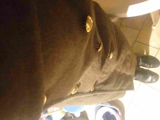Very old military jacket.
French capote
Seen as strange selfie, we see feet