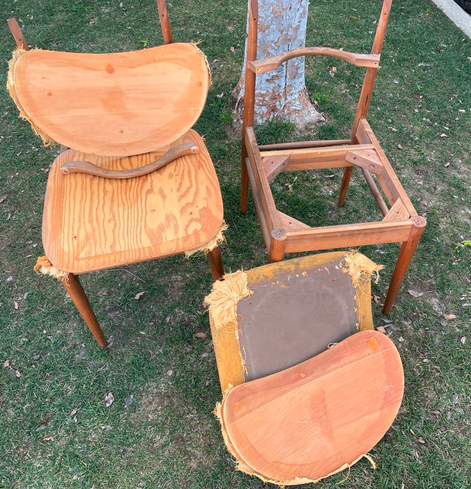 Chair parts on a lawn, bits of old fabric everywhere.