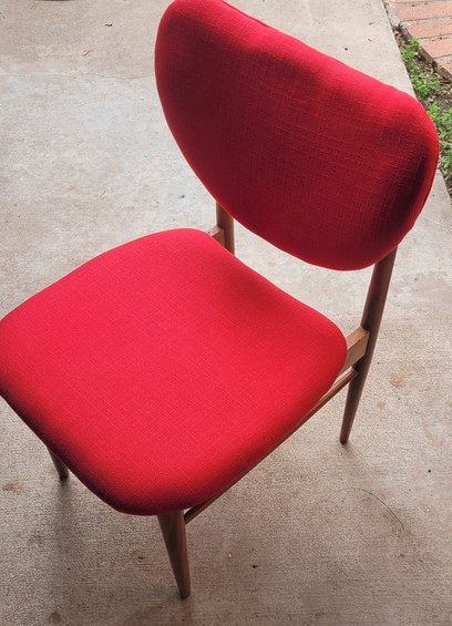 Red chair with new padding and new fabric
