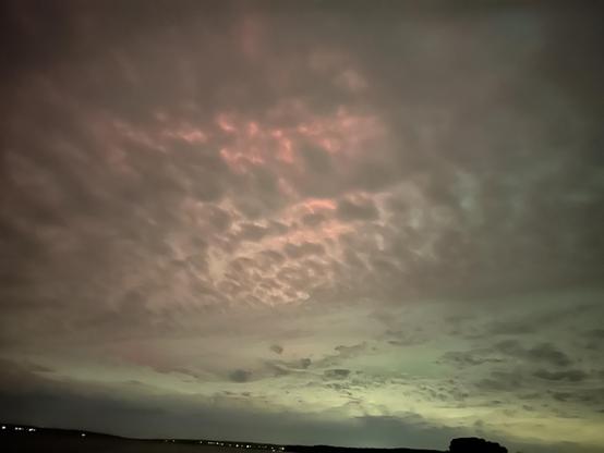 aurora behind some clouds