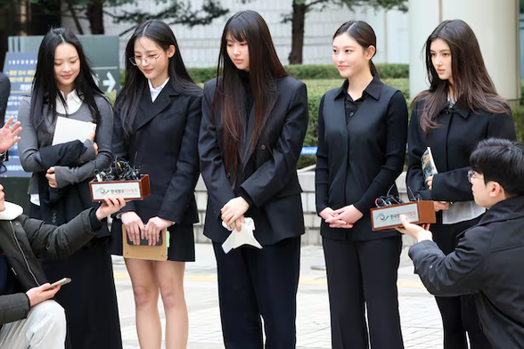 Group NewJeans (from left: Hanni, Minji, Hyein, Haerin, Danielle) answer questions from reporters after completing the first hearing for the provisional disposition filed by ADOR against the members regarding agency status preservation and prohibition of advertising contract conclusion, etc., at Seoul Central District Court in Seocho-gu, Seoul, on March 7. /News1