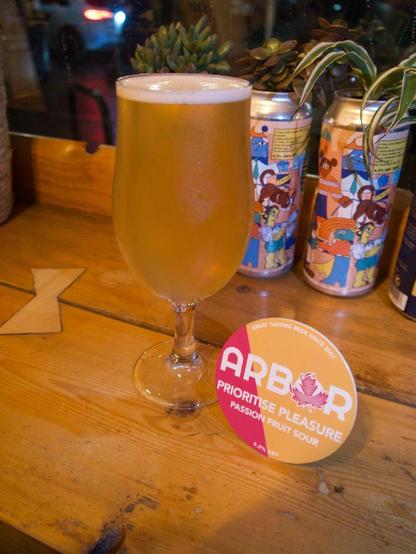 Two Thirds of Prioritise Pleasure with a keg badge