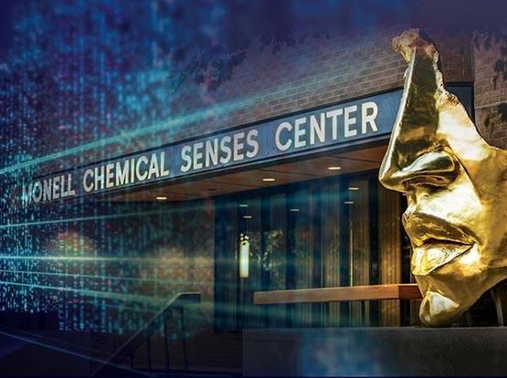 Photo of the entrance to the Monell Institute, with its golden sculpture of the nose-and-mouth portion of  human face