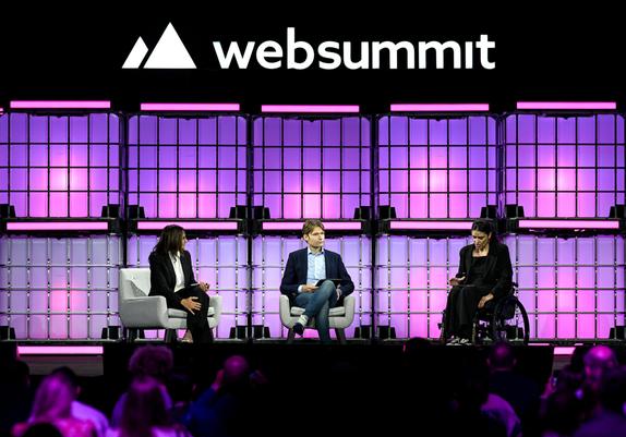 Preety, Otto and Caterina on stage in Lisbon under the Web Summit logo, in front of a large crowd.