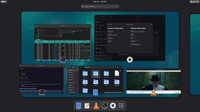 Gnome desktop with htop, gnome settings, lynx browser, nautilus and VLC media player playing trimmed what happen to the heart video by Leonard Cohen.