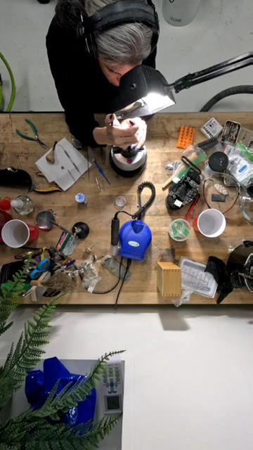 An over head shot of a table cluttered with jewelers tools. 
~
Een bovenaanzicht van een tafel vol juweliersgereedschap.
~
Une vue de dessus d’une table encombrée d’outils de bijoutier.