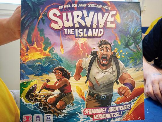 Die Vorderseite der Verpackung. Fliehende Menschen im Comiclook.