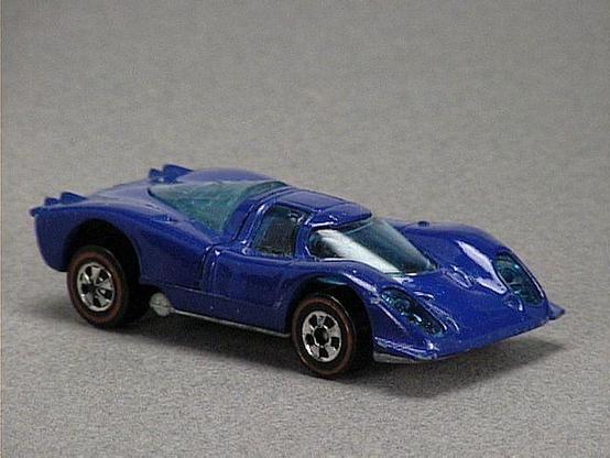 Released in 1973, Dark Blue Porsche 917 of 1973 Hot Wheels with Redline wheels. Notes: Rear engine cover opens up to reveal metal engine. Packaging: 1973 Blister. Metal Body, Metal Base. Made in Hong Kong. Scarcity: 8/10