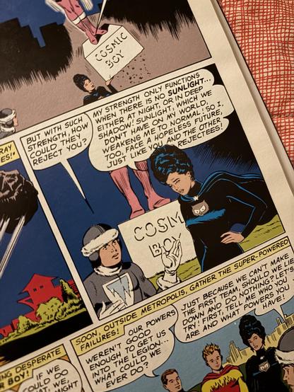 A comic panel in which Polar Boy (clad in gray furs) says “But with such strength how could they reject you?” To Night Girl (clad all in black, bearing an “owl” insignia, and sporting a giant black bouffant). She replies “My strength only functions when there is no sunlight…either at night, or in deep shadow! Sunlight, which we don’t have on my world, weakens me to normal! So I, too, face a hopeless future, just like you and the other rejectees!l