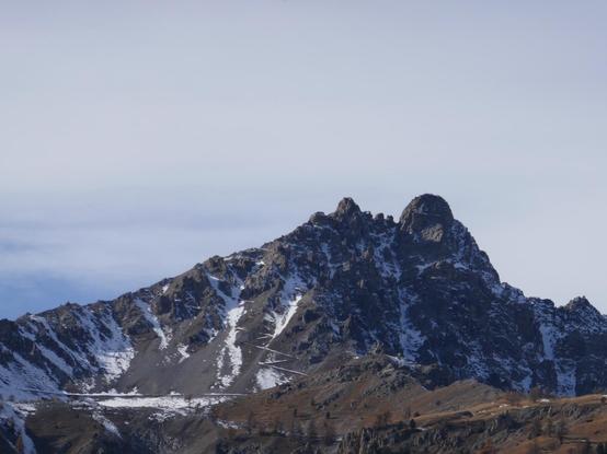 A mountain summit with a zig-zag route