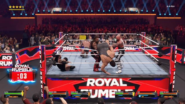 A chaotic scene in a wrestling ring. The wrestler on top appears to be delivering a punch, while the other is being thrown off their feet by the force of the blow. A referee watches intently from his elevated position as the crowd looks on with anticipation.