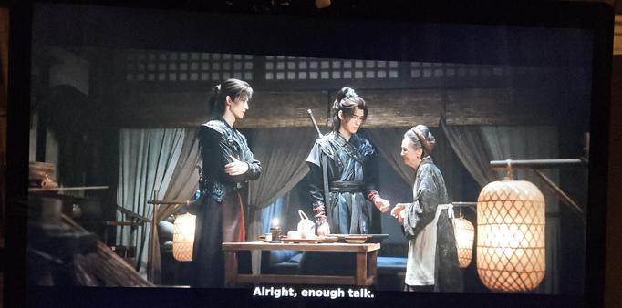 Chang He with arms folded over his torso tries to keep his distance but looks like he's about to soften as he glances at Su Mu Yu. Su, in turn, has taken an awkward step forward to comfort the little lady. The little lady, at least a head shorter than the other two, is holding in sobs and trying to keep it together for her guests.