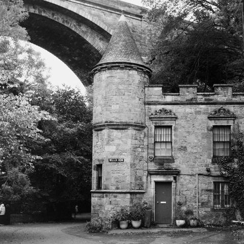 Yashica MAT124G | Cinestill BWXX 250 | Shot at 400 + Med Yellow Filter | Developed in XTOL
A small castle-looking building underneath a large stone bridge (Deans Bridge if I recall correctly). Building is labeled “Millers Row”