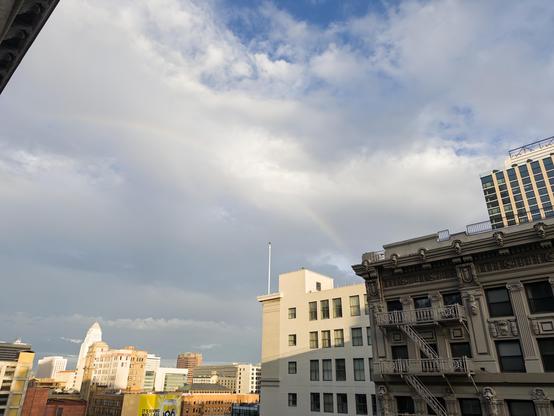 Rainbow arcing across the sky in downtown Los Angeles