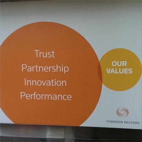 A slide from a Thomson Reuters presentation. At left, a large orange circle with the words Trust, Partnership, Innovation, Performance (one word per line)

At right, a small yellow circle with the words OUR VALUES. 

There is a very small overlap between the circles, making it appear to be a Venn diagram with very little overlap between the words at left and the values at right.