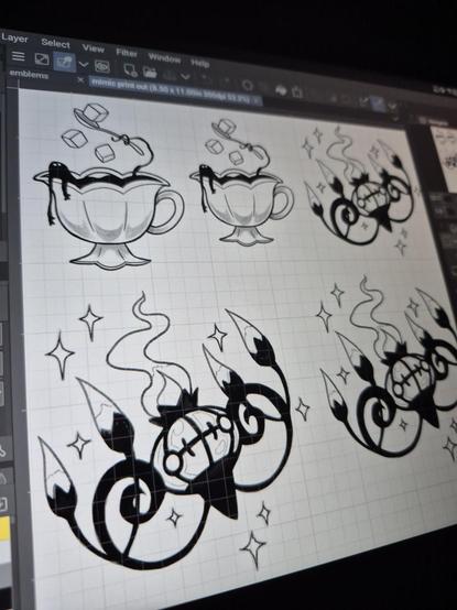 Photo of my drawing tablet with a set of tattoos to be done tomorrow. It's 2 different tattoos, with size options for th3 client. One is from my mimic flash sheet of a mimic hanging out in a teacup giving itself sugar. The other is of the pokemon Chandelure.