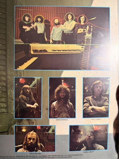 A shot of the back of thr LP jacket, featuring a picture of “Philip Collins,” full head of long hair and all