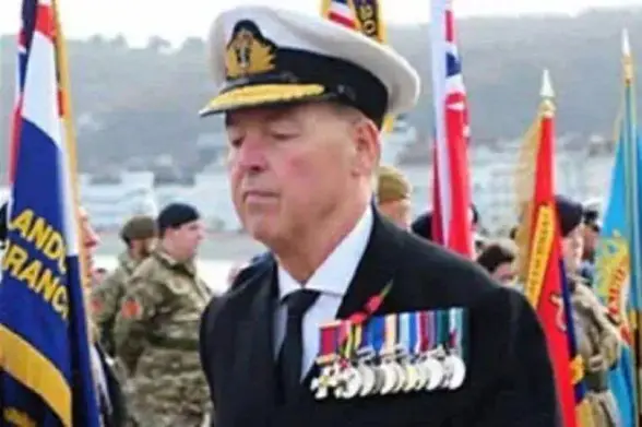 Fake navel officer with a chest full of  medals, at Remembrance Day in Llandudno.