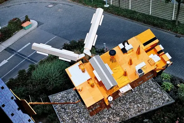 The image appears to show an aerial view of a satellite or spacecraft model. It features reflective surfaces and various instruments typically associated with satellites, such as antennas and solar panels. The setting seems to be outside, possibly on a rooftop or a designated area for displaying the satellite. If you have specific questions about it, feel free to ask!

Image Credits: Wikimedia / No machine-readable author provided. Ysangkok assumed (based on copyright claims). / Public domain