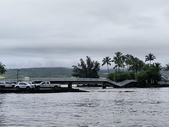 Photo of a small bridge with a collapsed section on the right