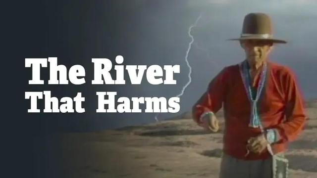 A Navajo (Dine) elder standing in the desert. Text: The River That Harms