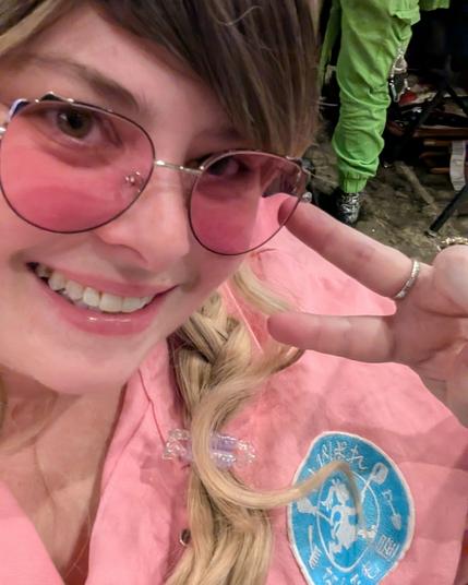 the artist taking a selfie in Sachika cosplay