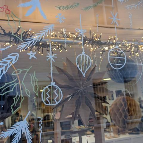 Close-up of some of the drawn-on baubles and decorations on the window