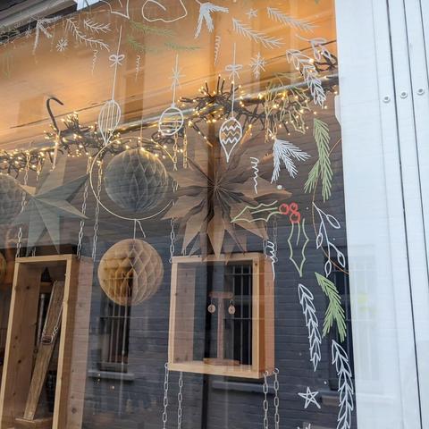 Close-up of some of the drawn-on festive decorations on the shop window