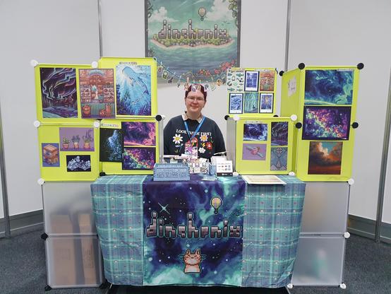 Dinchen sitting behind her table at Mag-C, the set-up is significant smaller than in the other picture