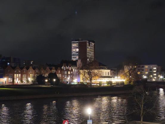 River, city at night, autumn lights outside at a restaurant