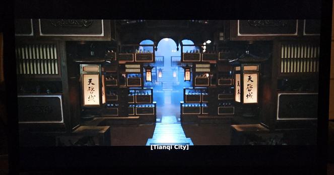 A room with three layers of room dividers built out of shelving units - the kinds that mixes shelves, drawer units, and bamboo lattices.