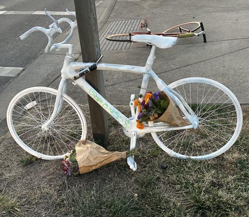 image of a ghostbike,  an all white bike to commemorate the death of a cyclist, killed by a car.