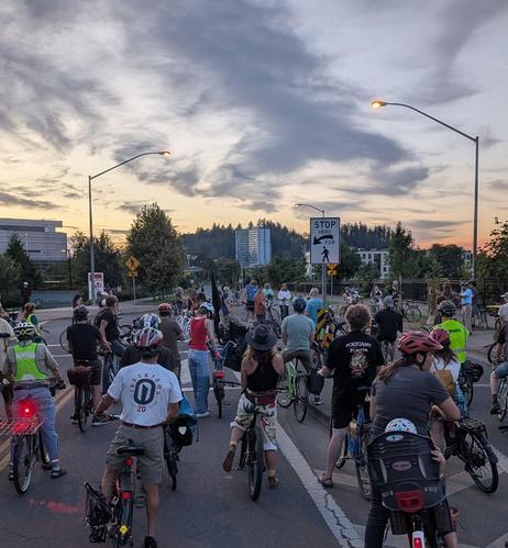 crowd of critical mass riders gathering around the ghost bike to mourn the loss of Elizabeth Cardenas Figueroa