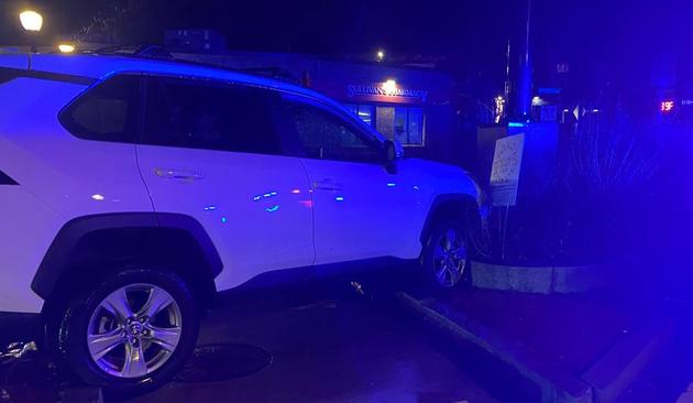 SUV jammed into curb-protected pedestrian crossing