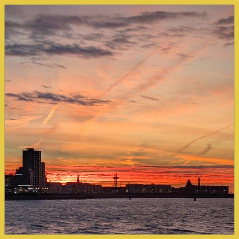 skyline of Vlissingen Boulevard in an orange morning sky
